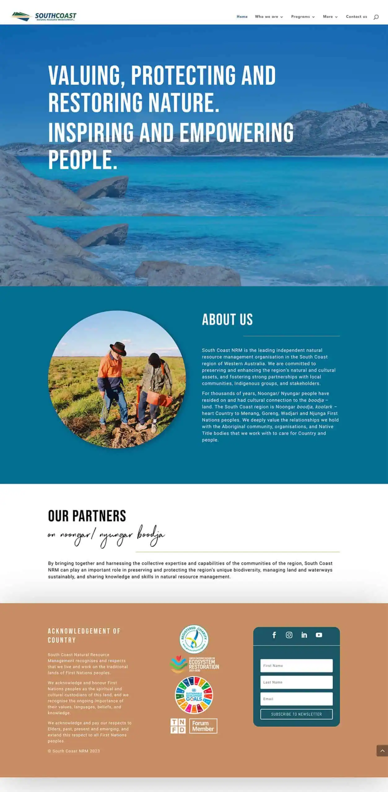 Screenshot of the South Coast NRM website homepage featuring a nature scene, organisational mission, a photo of two people in a field, partner acknowledgements, and contact information.
