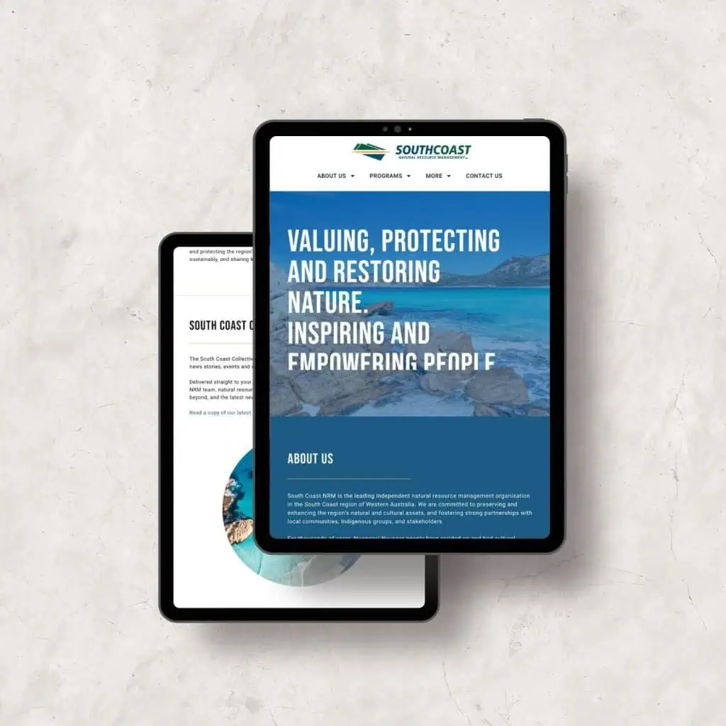 Two tablets displayed on a marble surface; the front screen shows a website with text about valuing, protecting, and restoring nature, whilst the rear screen shows a different webpage section.